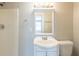 Bathroom with a bright white vanity and a reflective mirror at 940 Blair Bridge Rd, Austell, GA 30168