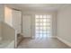 Carpeted bedroom with a view of the exterior through a glass block window at 940 Blair Bridge Rd, Austell, GA 30168