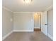 Bedroom with a large window, plush carpet, and trim molding at 940 Blair Bridge Rd, Austell, GA 30168