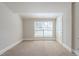 Spacious bedroom filled with natural light from the large window at 940 Blair Bridge Rd, Austell, GA 30168