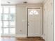 Bright entryway with large windows, white trim, and wood-look flooring at 940 Blair Bridge Rd, Austell, GA 30168
