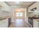 Well-equipped kitchen with stainless steel appliances and an open view into the dining area at 940 Blair Bridge Rd, Austell, GA 30168