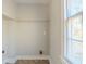 Functional laundry room space with a utility hook-up and window at 940 Blair Bridge Rd, Austell, GA 30168