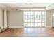 Spacious living room with hardwood floors, crown molding, and a large window at 940 Blair Bridge Rd, Austell, GA 30168