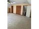 Spacious bedroom with neutral carpet, large closet, and access to additional storage at 1531 Glendale Dr, Lawrenceville, GA 30043