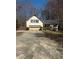 Traditional home with a two-car garage and driveway at 1531 Glendale Dr, Lawrenceville, GA 30043
