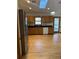 Well-equipped kitchen with stainless steel refrigerator and wooden cabinets at 1531 Glendale Dr, Lawrenceville, GA 30043