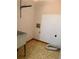 Functional laundry room with a utility sink and washer/dryer hookups on tiled floor at 1531 Glendale Dr, Lawrenceville, GA 30043