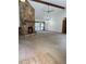 Open living room featuring a stone fireplace and natural light at 1531 Glendale Dr, Lawrenceville, GA 30043