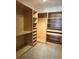 Walk-in closet with custom shelving, drawers, and ample storage space at 1531 Glendale Dr, Lawrenceville, GA 30043
