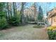 Lawn and treed area beside brick home in backyard at 2236 Chestnut Hill Cir, Decatur, GA 30032