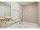 Bathroom featuring tub, granite countertop vanity, and modern tile at 2236 Chestnut Hill Cir, Decatur, GA 30032