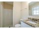 Well-lit bathroom featuring granite countertop vanity and a tile shower and updated fixture at 2236 Chestnut Hill Cir, Decatur, GA 30032