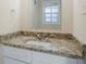 Bathroom vanity with granite countertop, mirror, and white cabinetry at 2236 Chestnut Hill Cir, Decatur, GA 30032