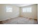 Sun-drenched bedroom with neutral carpet and large, bright windows at 2236 Chestnut Hill Cir, Decatur, GA 30032