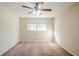 Cozy bedroom features a ceiling fan and a window that floods the space with natural light at 2236 Chestnut Hill Cir, Decatur, GA 30032