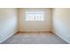 A quiet bedroom with neutral carpet and a single window at 2236 Chestnut Hill Cir, Decatur, GA 30032