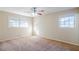 This bedroom has two windows and a ceiling fan to keep the space cool and bright at 2236 Chestnut Hill Cir, Decatur, GA 30032