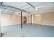 View of garage with painted floors, overhead lighting, and garage door at 2236 Chestnut Hill Cir, Decatur, GA 30032