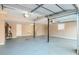 Spacious garage with painted floor, shelving and overhead lighting at 2236 Chestnut Hill Cir, Decatur, GA 30032