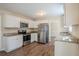 Modern kitchen featuring white cabinetry, stainless steel appliances and dark wood flooring at 2236 Chestnut Hill Cir, Decatur, GA 30032