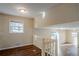 Upstairs living room features great light, hardwood floors and a staircase to another level at 2236 Chestnut Hill Cir, Decatur, GA 30032