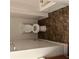 Bathroom featuring a tub, toilet and storage at 3626 Hopkins Ct, Powder Springs, GA 30127