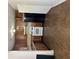 Galley style kitchen with wooden cabinets, white appliances and vinyl floor at 3626 Hopkins Ct, Powder Springs, GA 30127