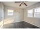 Bedroom with a ceiling fan, two windows, and wall decals at 473 Oakside Sw Dr, Atlanta, GA 30331