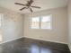 Bedroom with ceiling fan, large windows, and butterfly wall decals at 473 Oakside Sw Dr, Atlanta, GA 30331