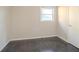 This bedroom features a window and hardwood floors at 473 Oakside Sw Dr, Atlanta, GA 30331