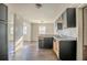 View of kitchen area showcasing cabinetry, stainless appliances, and modern flooring at 473 Oakside Sw Dr, Atlanta, GA 30331