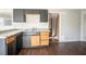 Kitchen featuring modern countertops, cabinetry, and updated floors at 473 Oakside Sw Dr, Atlanta, GA 30331
