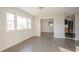 Bright living room featuring large windows and modern wood flooring at 473 Oakside Sw Dr, Atlanta, GA 30331