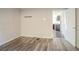 Room with hardwood floors with a doorway leading to the kitchen at 473 Oakside Sw Dr, Atlanta, GA 30331