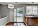 Bright kitchen features granite countertops, stainless steel appliances, and sliding glass door to back yard at 1064 Wenham Ln, Lawrenceville, GA 30044