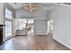Spacious living room with soaring ceilings, wood floors and open access to the kitchen area at 1064 Wenham Ln, Lawrenceville, GA 30044