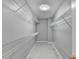 A walk-in closet featuring wire shelving on the walls at 1064 Wenham Ln, Lawrenceville, GA 30044