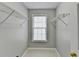 A walk-in closet featuring wire shelving and a window at 1064 Wenham Ln, Lawrenceville, GA 30044