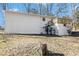 The backyard has white siding and a wooden deck on the upper level at 4326 Newton Cir, Douglasville, GA 30134