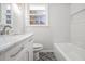 Bathroom featuring marble countertops, vanity, and modern fixtures, creating a spa-like experience at 4326 Newton Cir, Douglasville, GA 30134