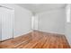 Bedroom with hardwood floors, neutral walls, and a closet, offering a comfortable space at 4326 Newton Cir, Douglasville, GA 30134