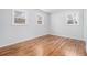 Bedroom with hardwood floors and three windows providing ample natural light at 4326 Newton Cir, Douglasville, GA 30134