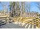 Wooden deck surrounded by lush trees, offering privacy and a serene outdoor setting at 4326 Newton Cir, Douglasville, GA 30134