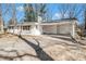 Updated, white brick home featuring a covered carport and long driveway at 4326 Newton Cir, Douglasville, GA 30134