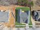 A house sits perfectly on its lot, surrounded by a newly installed lawn, ready for its new owners at 9089 Hanover St, Lithia Springs, GA 30122