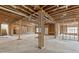Unfinished basement featuring exposed ceiling, concrete floors, and wood framing ready for customization at 9089 Hanover St, Lithia Springs, GA 30122