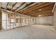 Spacious unfinished basement with concrete floors and exposed framing, offering potential for future expansion at 9089 Hanover St, Lithia Springs, GA 30122