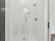 Bathroom featuring a clear glass shower, white subway tile and black accents at 9089 Hanover St, Lithia Springs, GA 30122