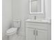 Bathroom featuring marble countertop vanity, modern lighting, and a toilet at 9089 Hanover St, Lithia Springs, GA 30122